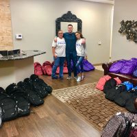 Backpacks and volunteers 2018 back to school