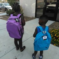 Back to school kids and backpacks