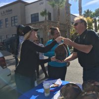 woman gives turkey to man 2017 Thanksgiving giveaway