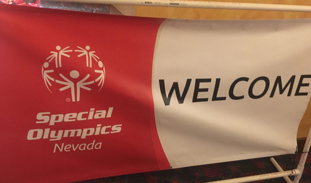 Community 5 Banner with "Special Olympics Nevada" logo and the word "Welcome," suitable for a personal injury law firm supporting the community in Las Vegas.