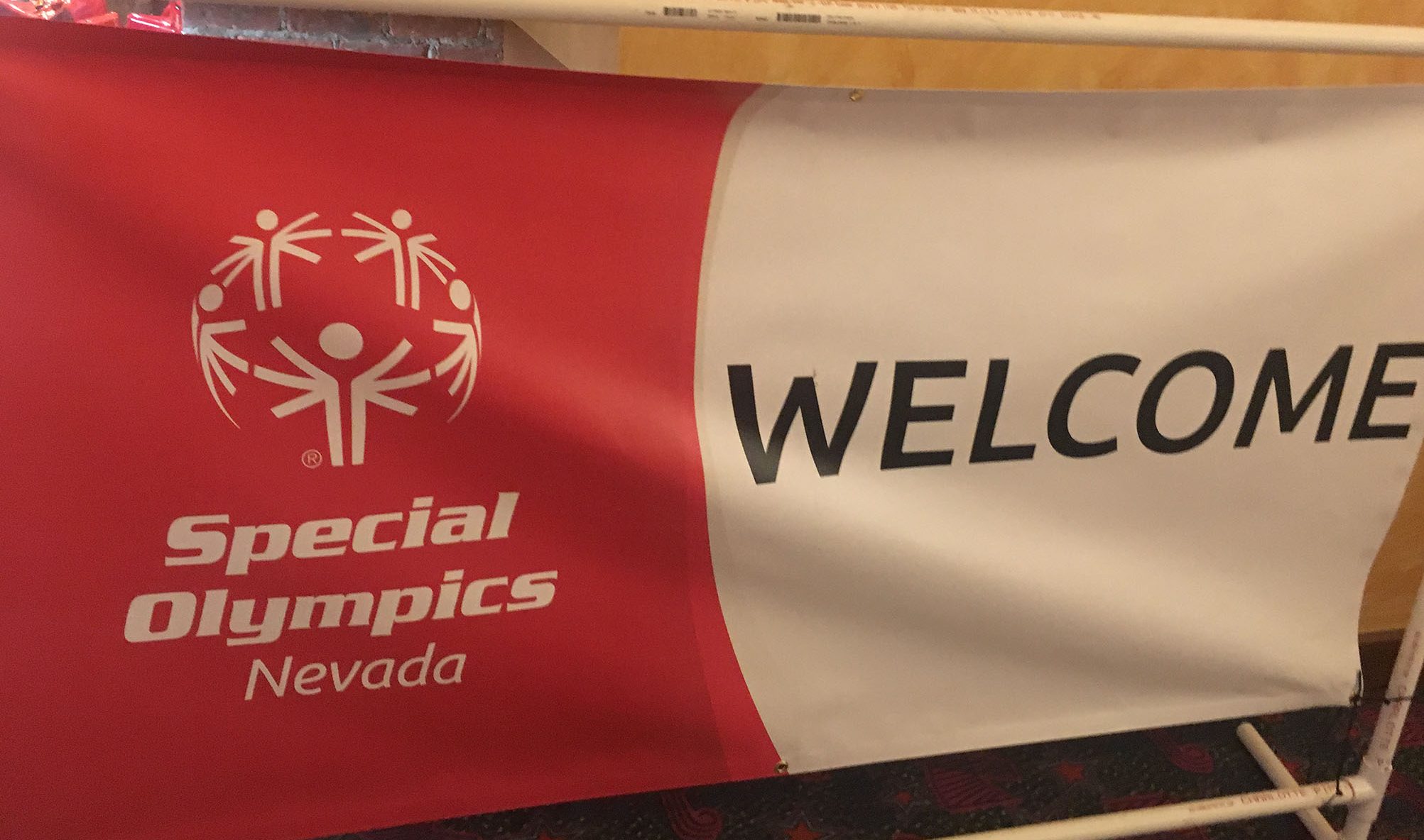 Banner with "Special Olympics Nevada" logo and the word "Welcome," suitable for a personal injury law firm supporting the community in Las Vegas.
