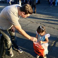 Paul Powell gives candy Trunk or Treat