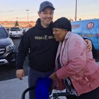 Paul Powell and woman turkey giveaway