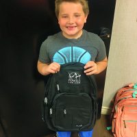 Young child and backpack
